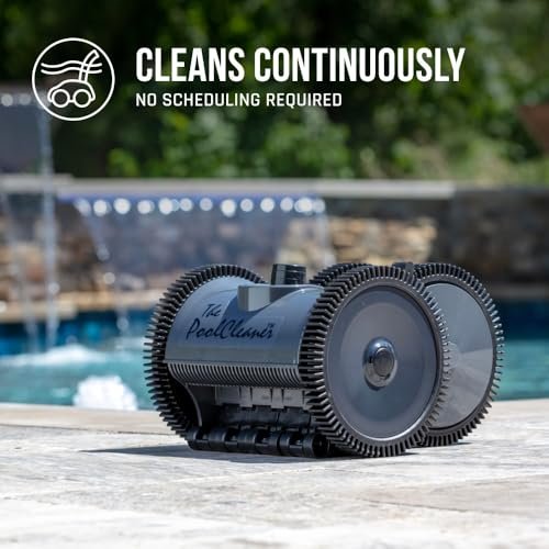 Poolvergnuegen - Dark gray Hayward W3PVS40GST 4-wheel PoolCleaner resting on pool edge with water feature in background conti